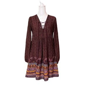 Bohemian free flowing dress lined lace up v-neck tassel ties.